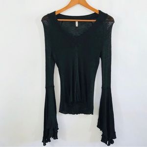 Free People Intimately So Dramatic Bell Sleeve Top in black.
Knit. Semi sheer.